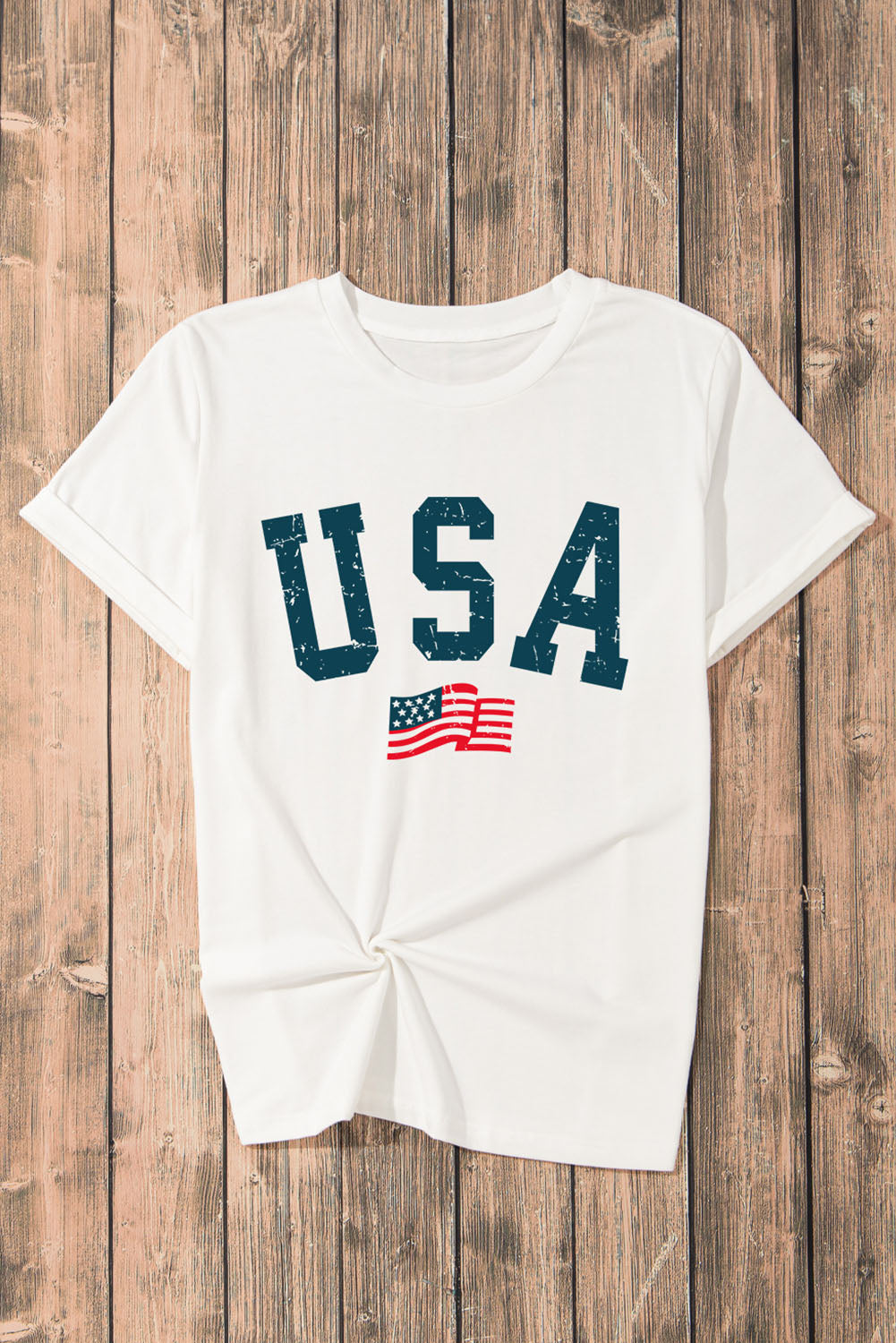 White graphic t-shirt with distressed USA text and American flag detail.
