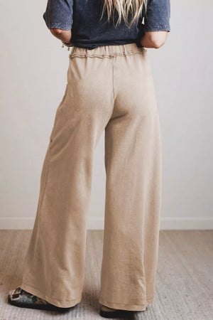 Mineral wash wide leg maternity pants in tan cotton with a high-rise elastic waist.