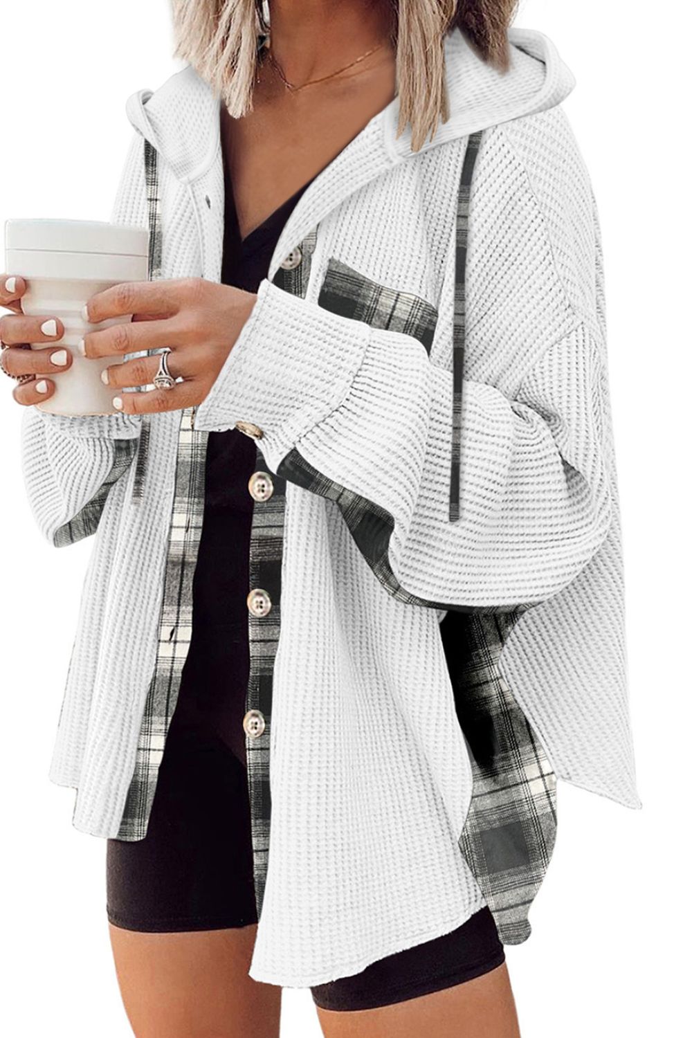 White waffle knit shacket with plaid trim and hood, button front, styled with a black top.
