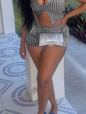 Chic halter top and shorts set with a cut-out detail in black and white stripes.
