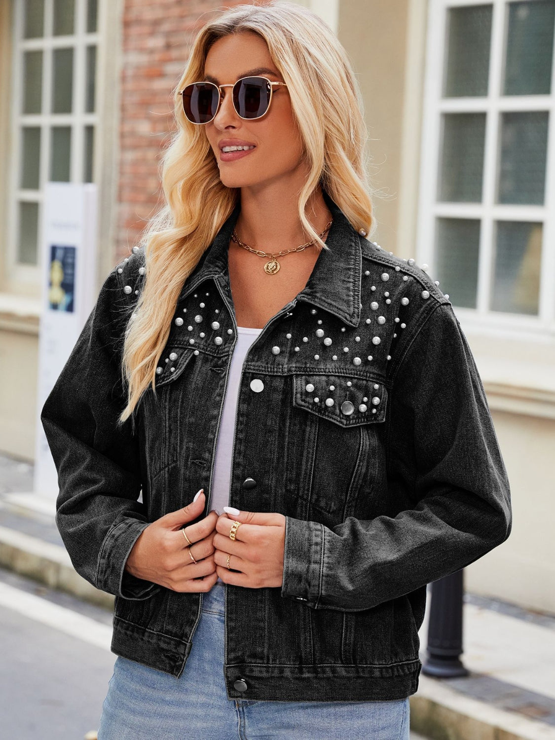 Black denim jacket with pearl embellishments, button front, and collar.