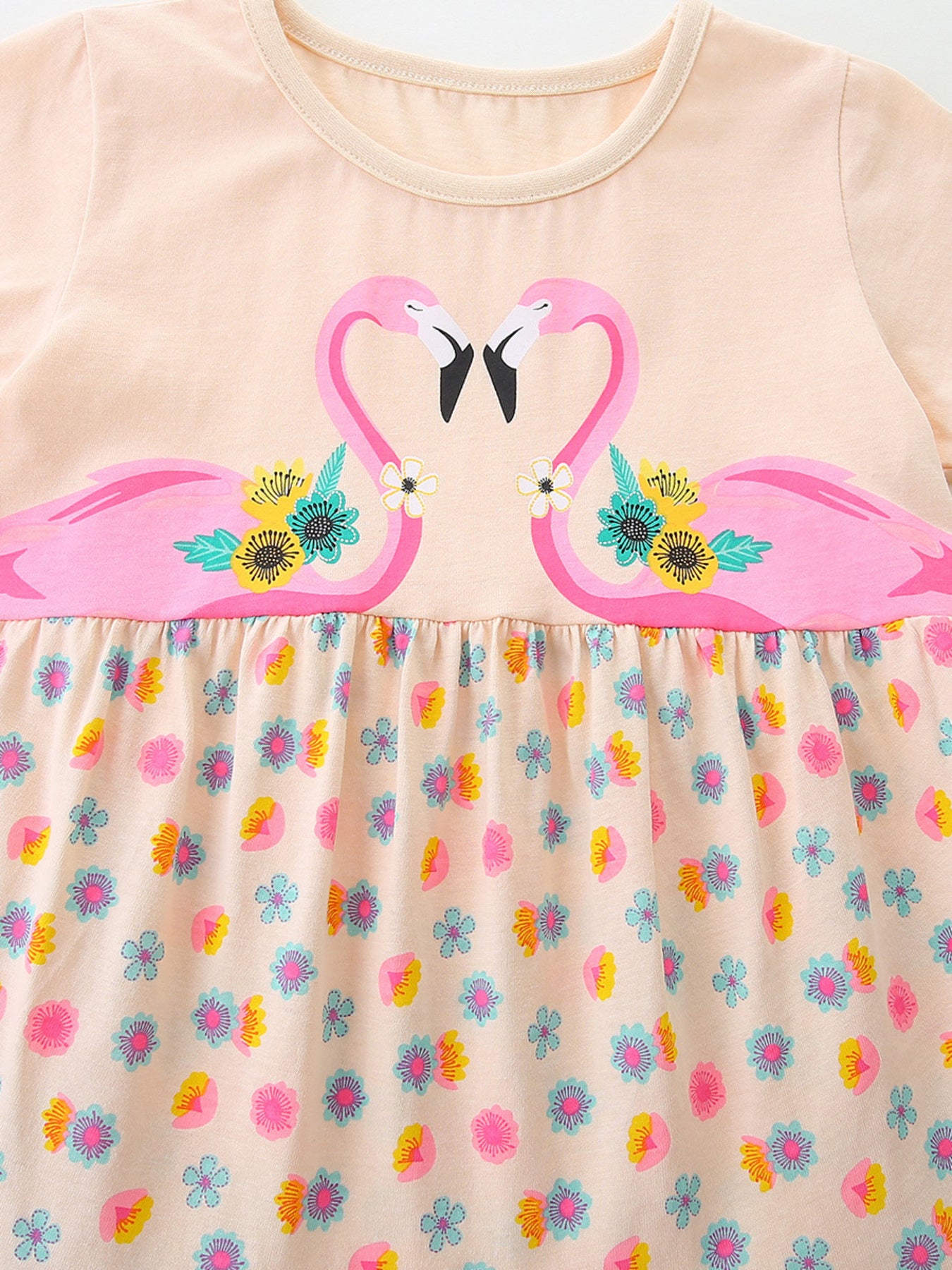 Peach cotton baby dress with flamingo print and floral skirt