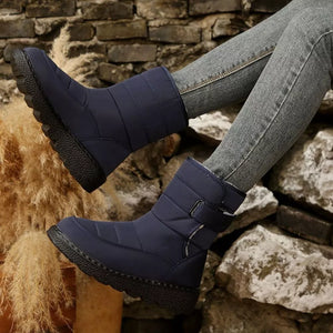 Blue quilted round toe platform boots with adjustable strap and chunky sole.