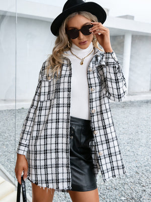 White plaid shacket with raw hem and buttoned front, styled with a turtleneck and leather skirt.