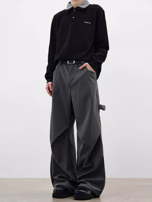 Men's grey pinstripe wide-leg sweatpants with pockets and a relaxed fit.