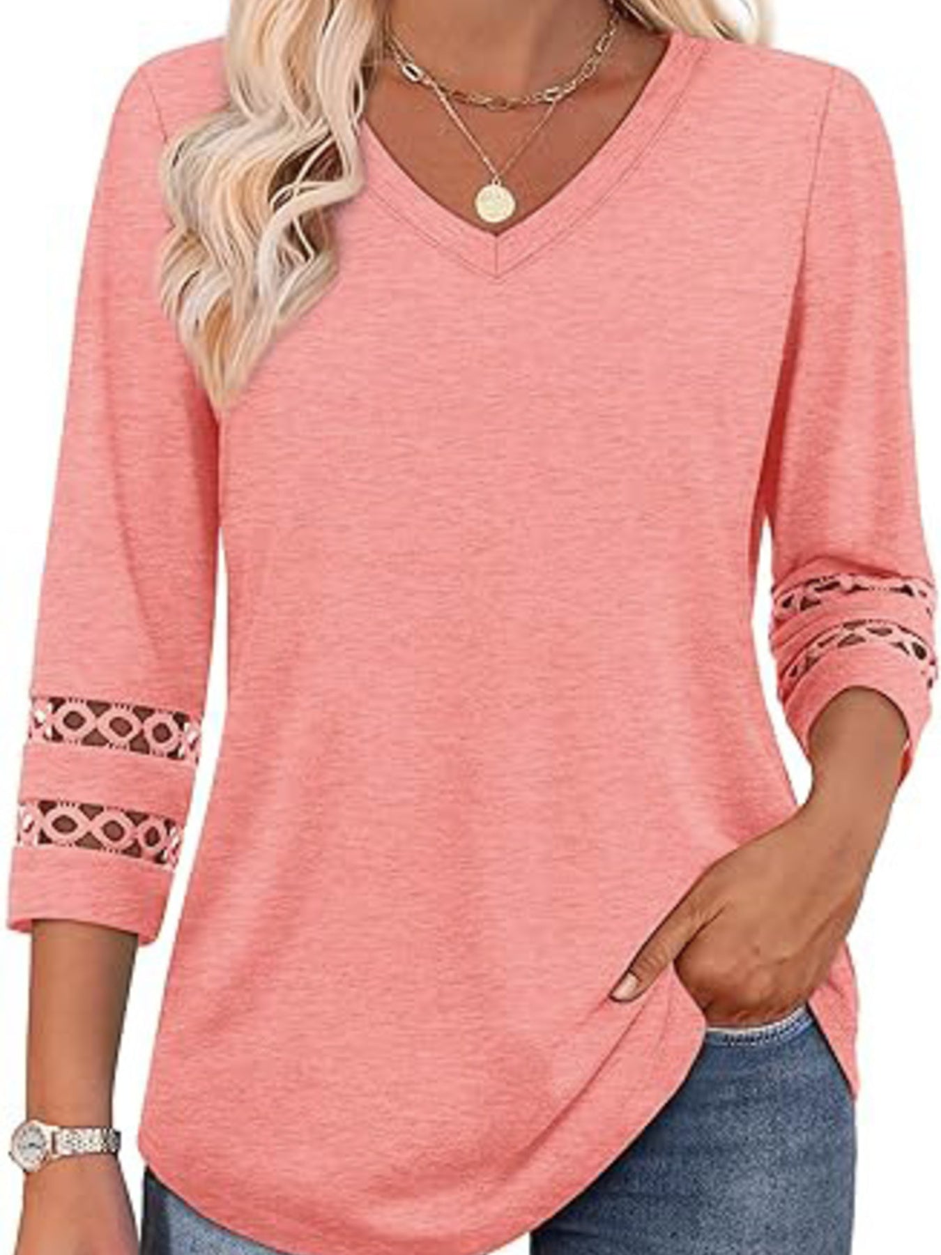 Pink V-neck t-shirt with 3/4 sleeves featuring cutout lace details on the cuffs.