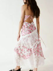 Floral lace maxi dress with ruffles and open back, featuring a pink floral print and white lace trim.