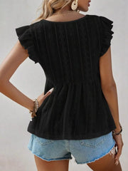 Black eyelet blouse with ruffle sleeves and peplum hem.