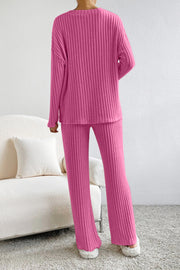 Hot Pink ribbed knit loungewear set with long sleeves and flared pants.