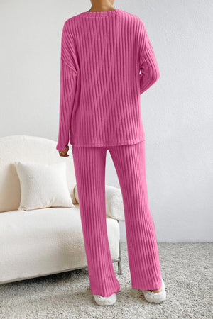 Hot Pink ribbed knit loungewear set with long sleeves and flared pants.