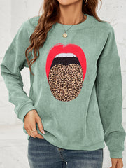 Light Green corduroy crewneck sweatshirt with a red lip and leopard print tongue graphic.