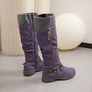 Purple suede knee-high slouch boots with grey knit detail and side zipper.
