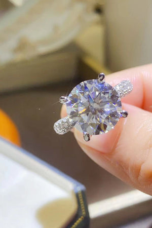 Silver ring with large round moissanite and pavé band detail