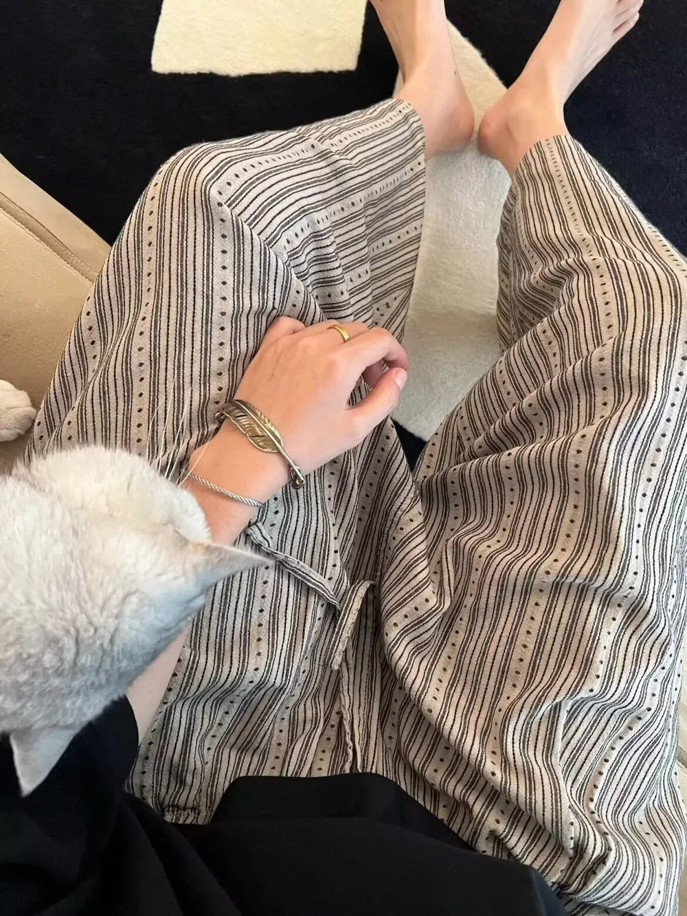 Men's wide-leg sweatpants with vertical stripes and dotted accents, featuring a drawstring waist.