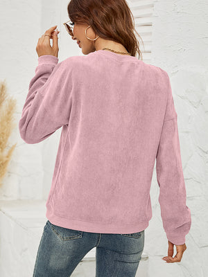 Dusty Pink corduroy sweatshirt with long sleeves and crew neck.
