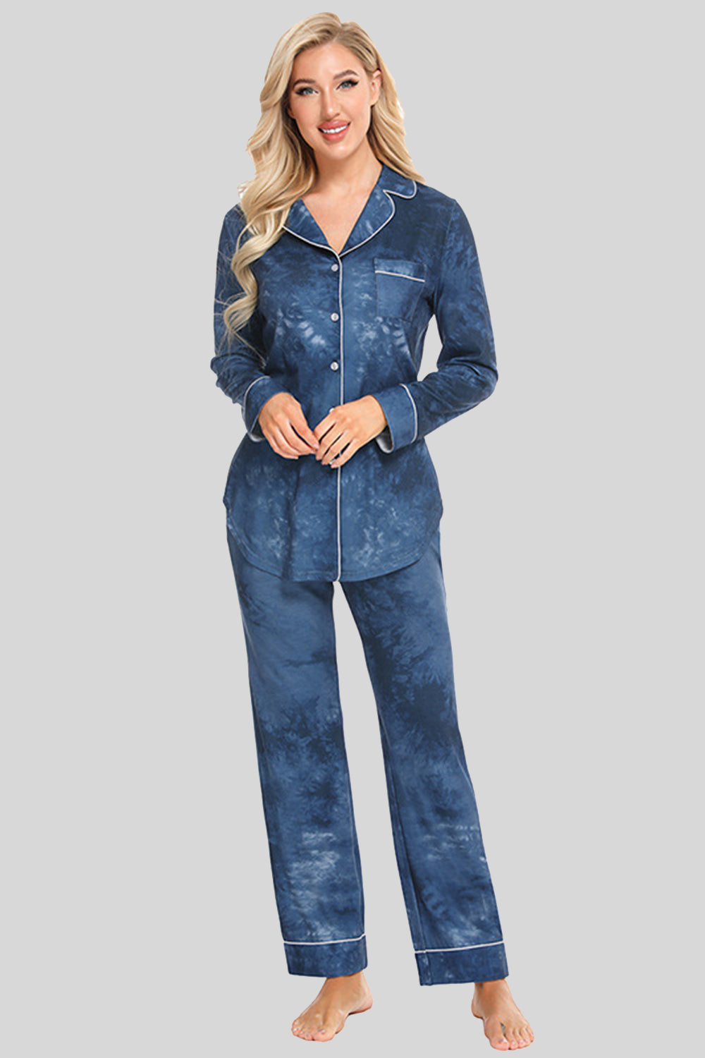 Pajama set in multicolor tie-dye with white piping, long sleeves, button front, and pockets.