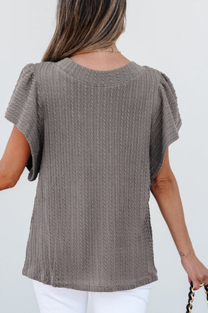 Gray cable knit flutter sleeve top with textured detail