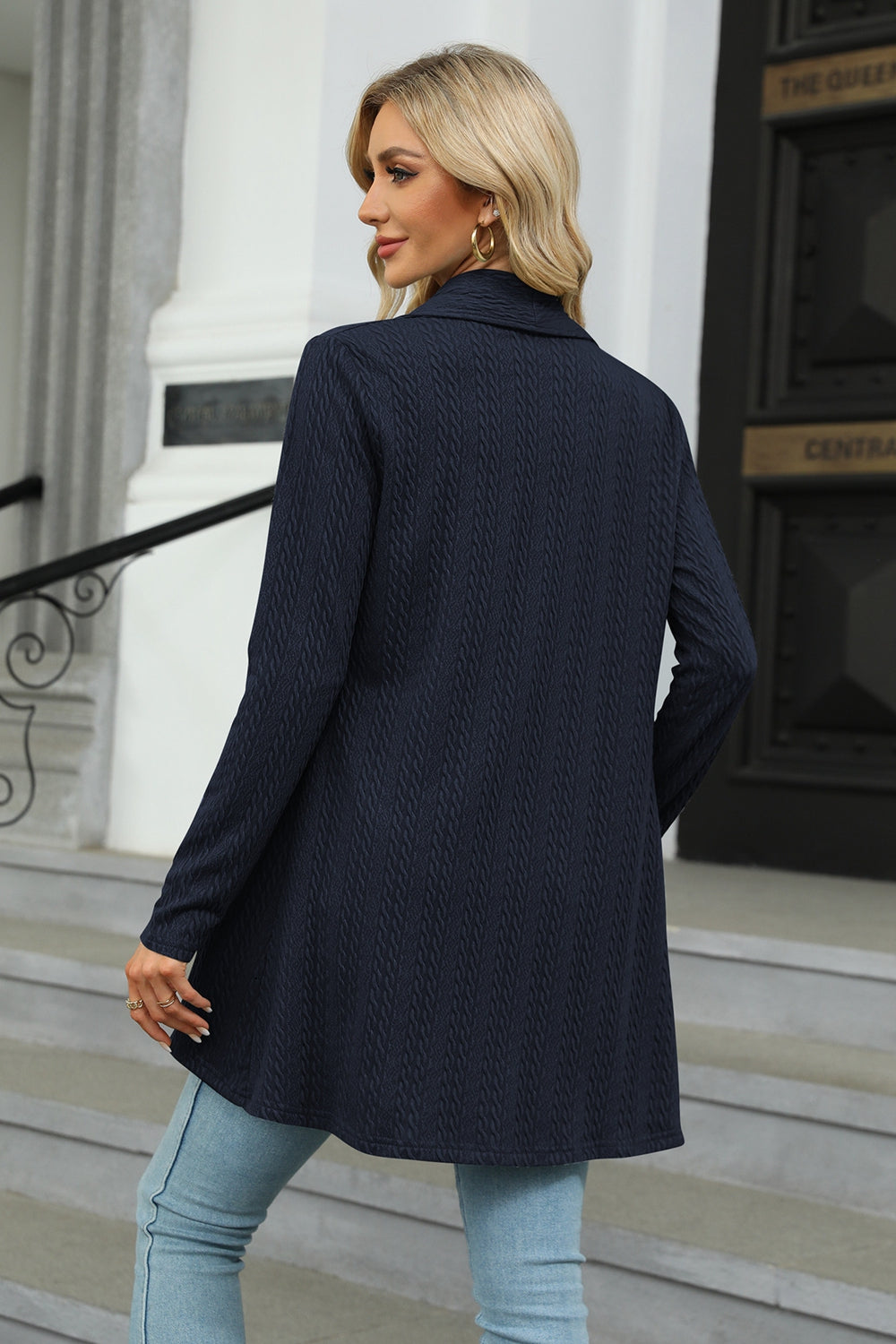 Dark Navy cable knit cardigan with a drape front and long sleeves.