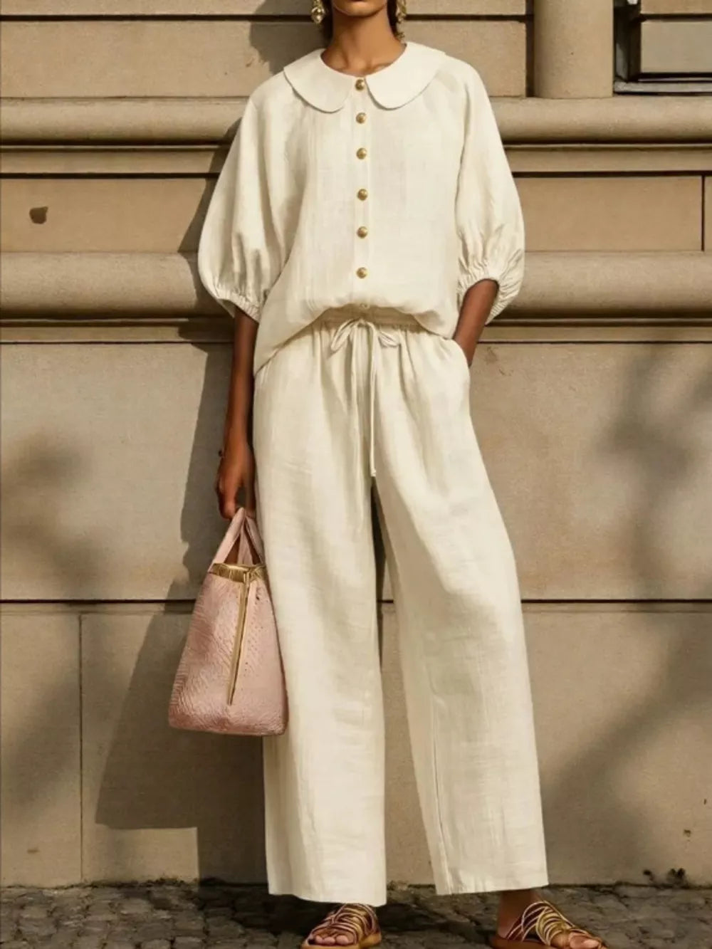 Chic monochrome two-piece set in apricot with pocketed top and drawstring pants.