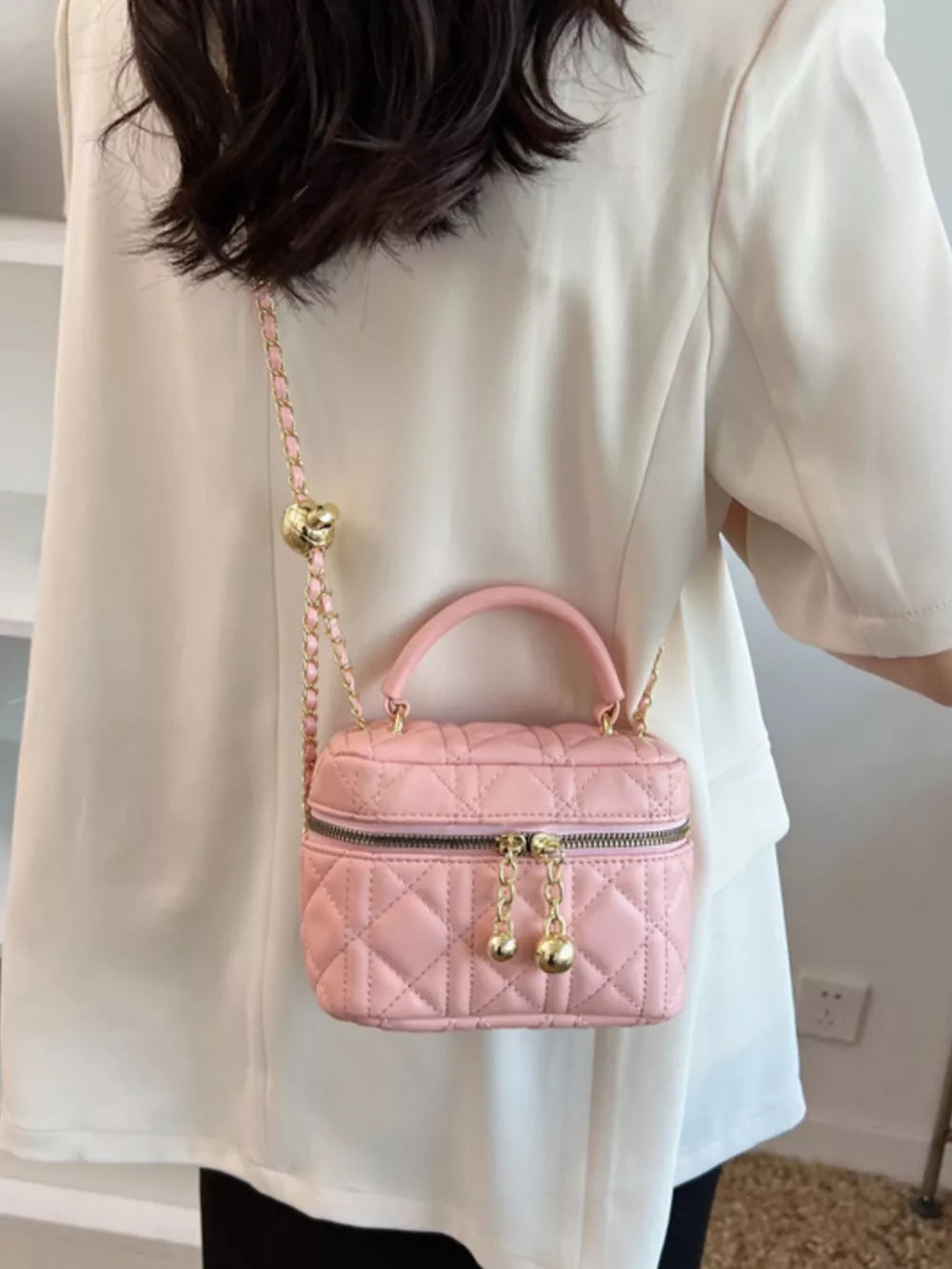Quilted Mini Top Handle Crossbody Bag in Hot Pink, model styling view
