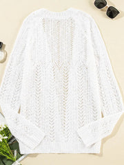 White openwork chevron knit cardigan with long sleeves and a V-neck.