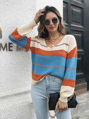 Colorblock knit V-neck pullover sweater in Azure with cream, orange, and blue stripes.