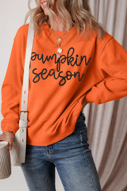 Orange graphic sweatshirt with "Pumpkin Season" text, crewneck, long sleeves, casual autumn style.
