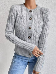 Gray cable-knit button-front cardigan with crew neck and textured sleeves.