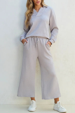 Gray textured quilted knit collared loungewear set with drawstring pants and long sleeves.