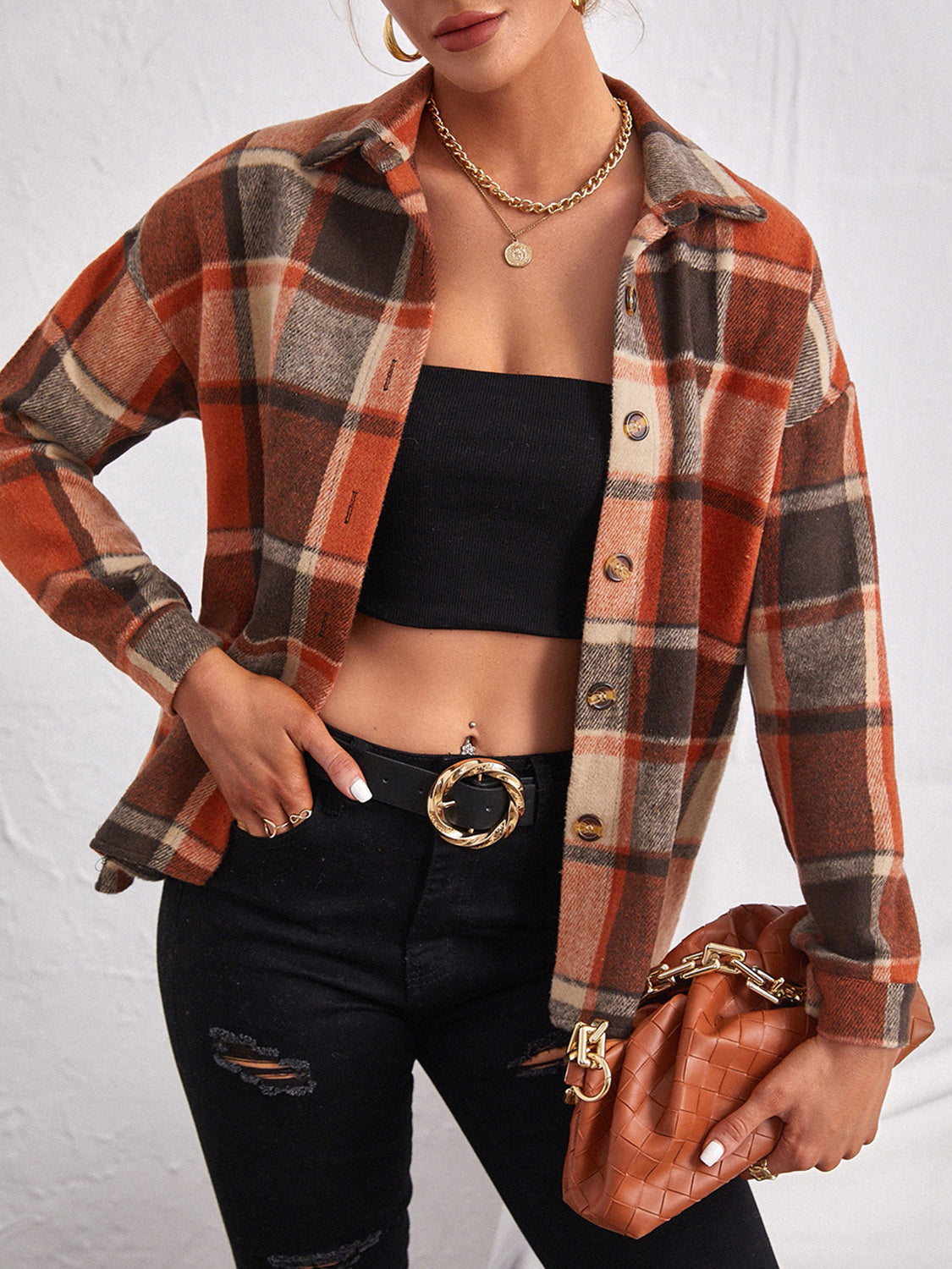 Oversized plaid shacket in ochre with button closure and collared neckline.