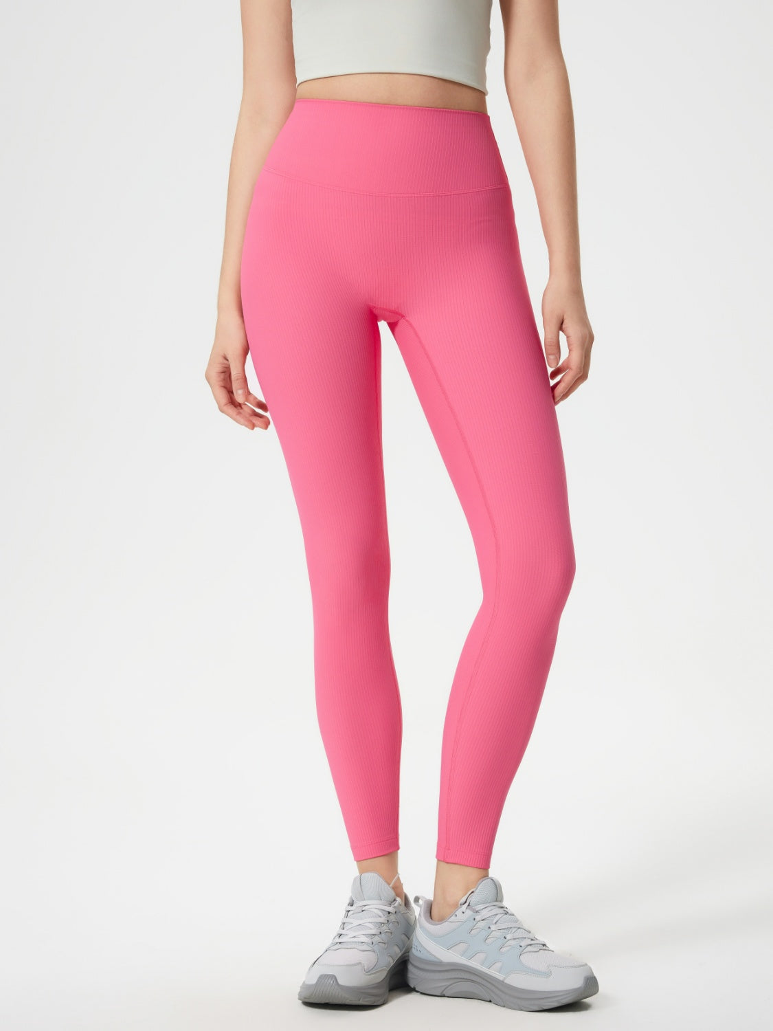 Pink ribbed high-waist leggings with a seamless sculpt fit.