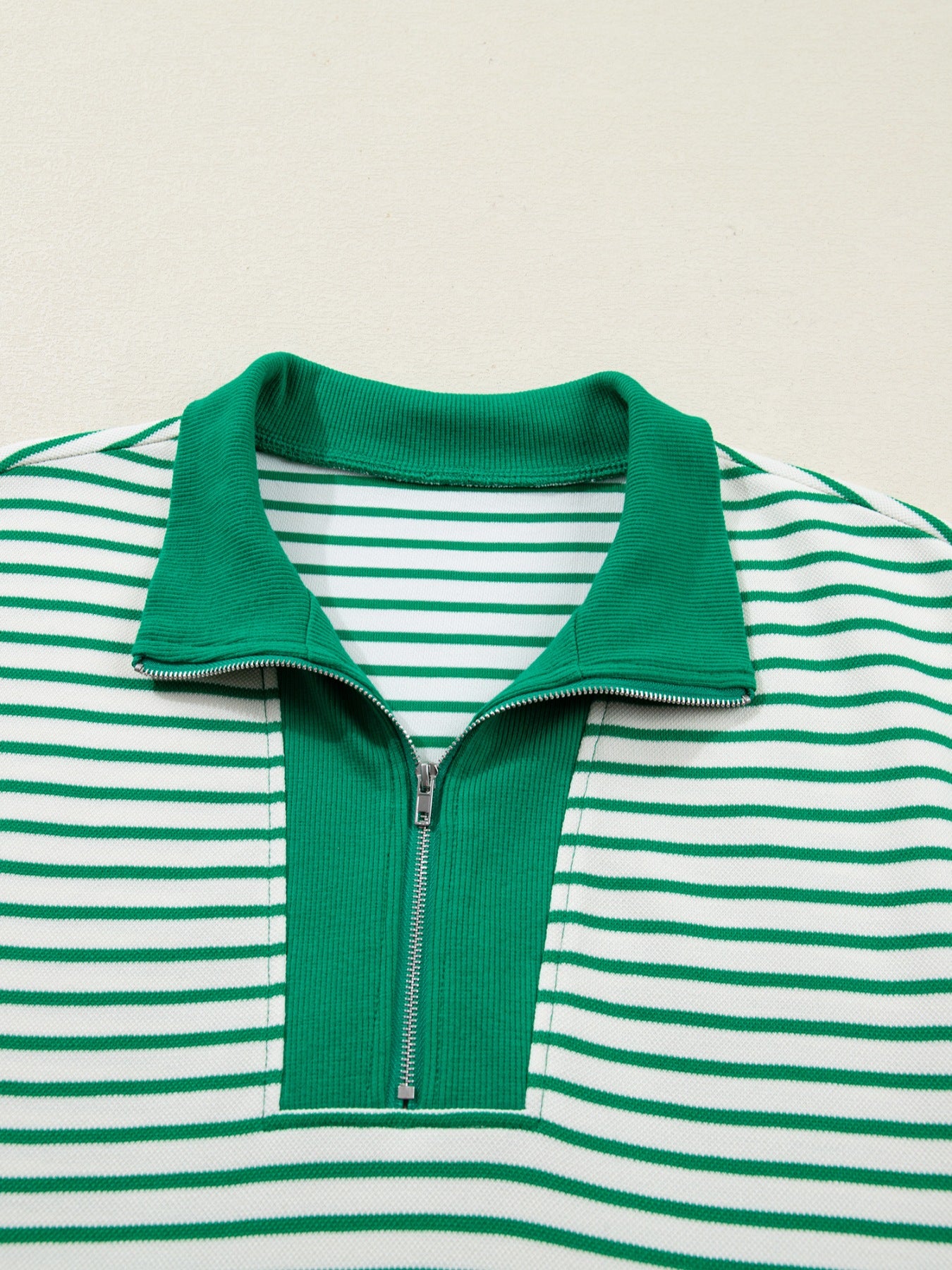 Green and white striped polo collar dress with quarter zip and pockets