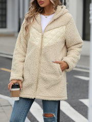 Cream teddy hoodie with quilted panel detail, zip front, and hood.