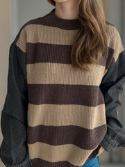 Brown and tan striped knit sweater with dark denim sleeves.
