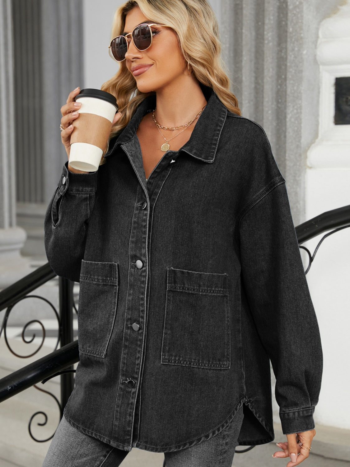 Black oversized denim trucker jacket with button front and chest pockets