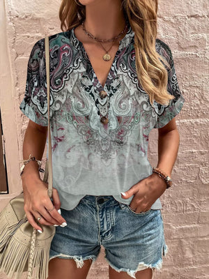 Bohemian tapestry henley blouse with paisley print, V-neck, and button detail.