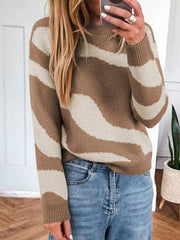 Cozy knit sweater with wavy camel and cream stripes, crew neck, long sleeves.