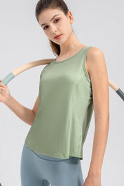 Light green performance tank top with curved back panel detail and round neckline.