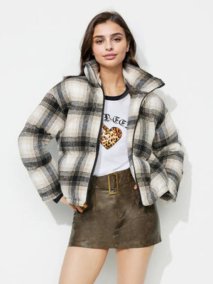 Plaid puffer jacket in gray with a high collar and zip closure.