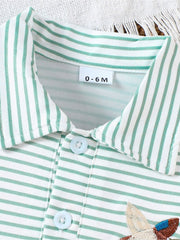 Striped green and white cotton polo shirt for baby with embroidered duck detail and light blue buttons.