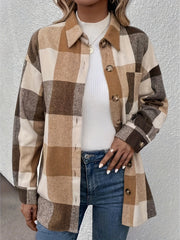 Oversized camel plaid shacket with button detail and collar, worn over a white turtleneck.