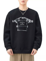 Men's black oversized graphic sweatshirt with crewneck and distressed print.