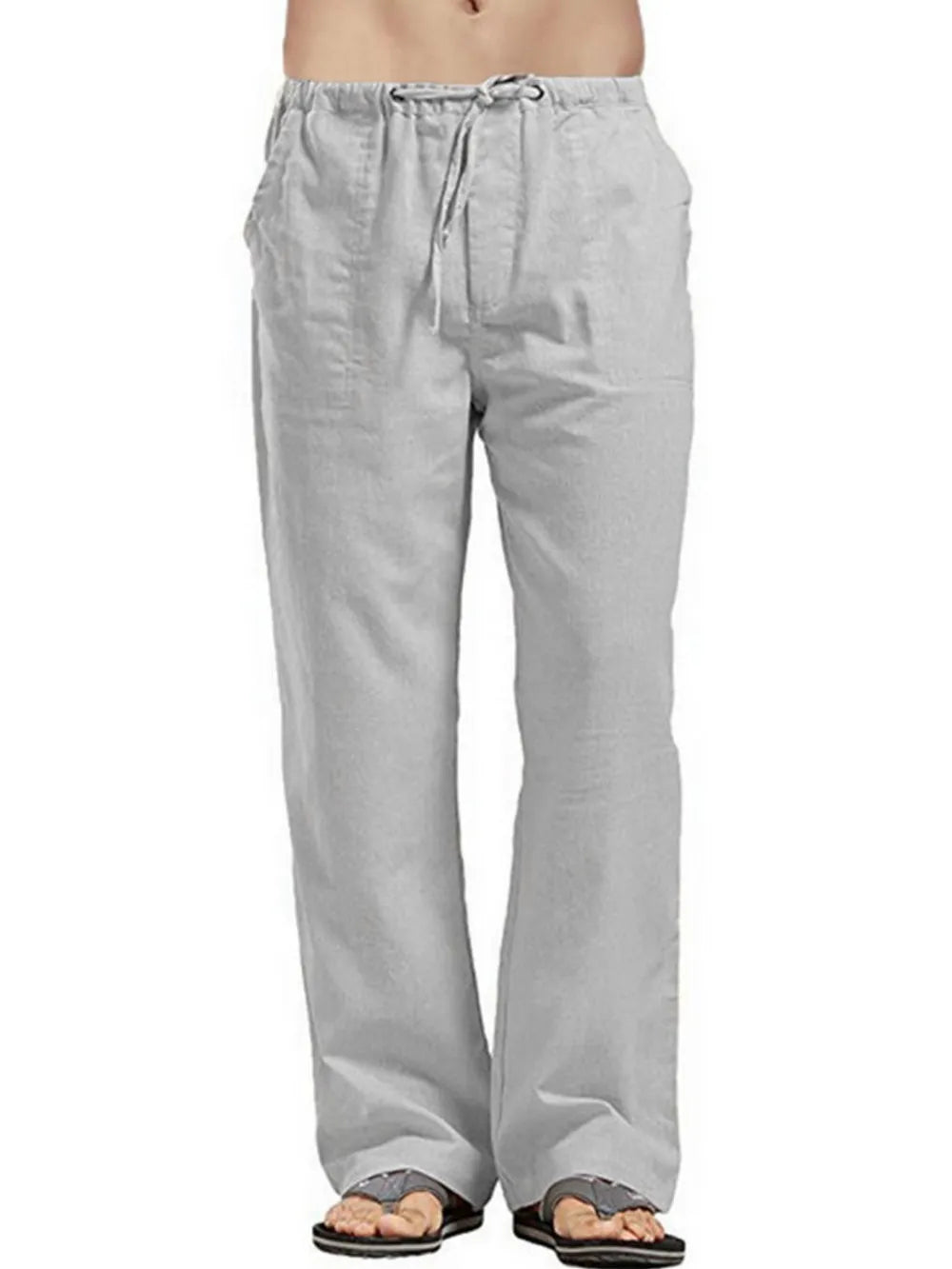 Gray linen drawstring trousers with a relaxed fit and pockets.