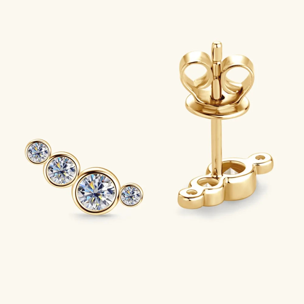 Gold ear climbers with three sparkling round-cut cubic zirconia stones in a graduated cluster design.