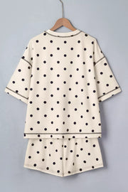 Cream polka dot two-piece set with drawstring shorts and short sleeve top.