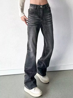Men's black vintage high-waisted straight leg jeans with button closure and cotton blend material.