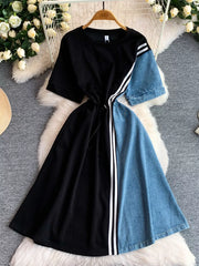 Black and denim color block casual dress with drawstring and white stripes.