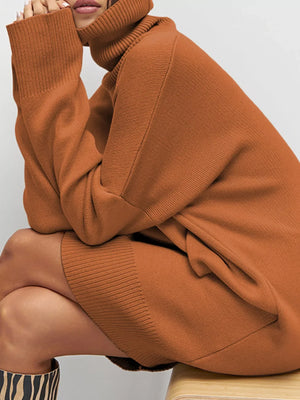 Caramel drop shoulder turtleneck sweater dress with ribbed cuffs and hem.