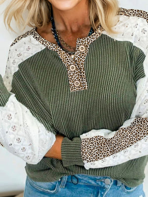 Waffle knit henley top in dark green with leopard print and lace sleeves.