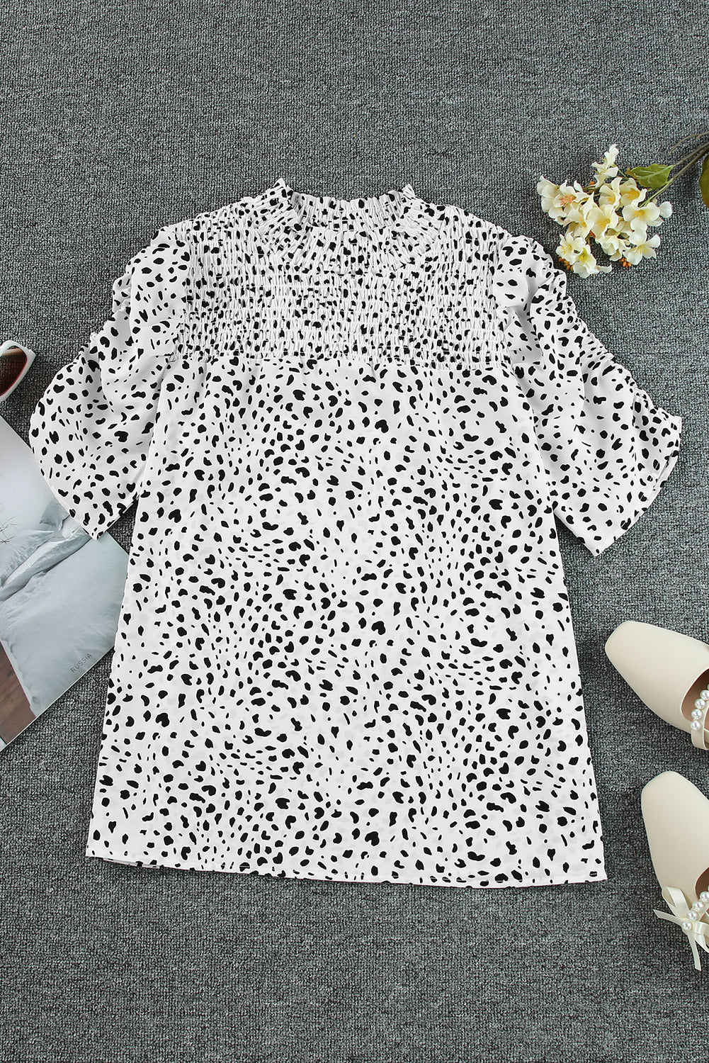White dalmatian print blouse with shirred yoke and short sleeves